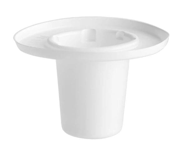 A white cup with a plate on top of it.